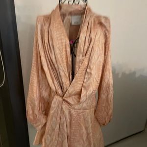 Acler wraparound blush colored dress.